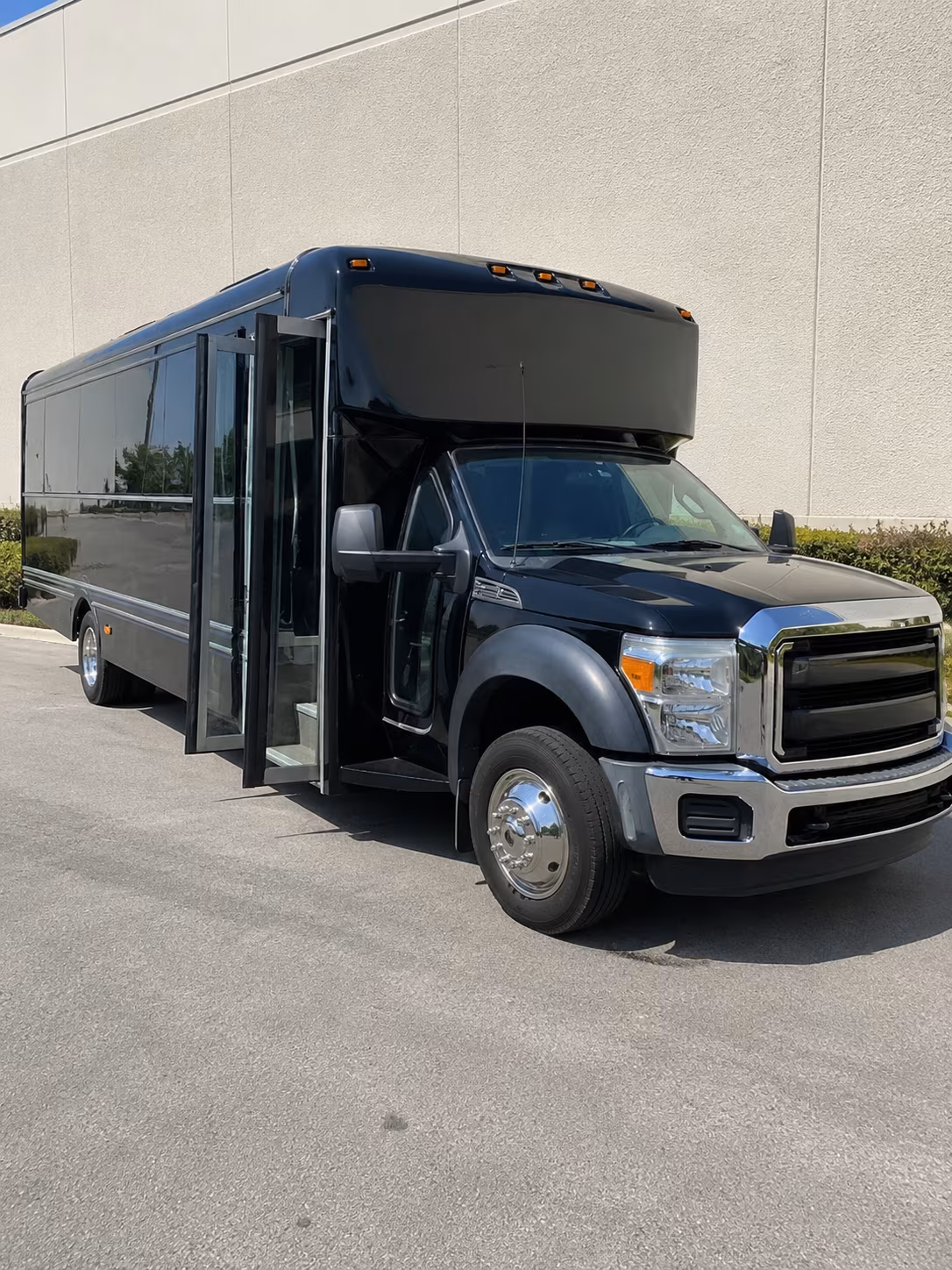 Group beside a Mercedes Sprinter limo in Dallas