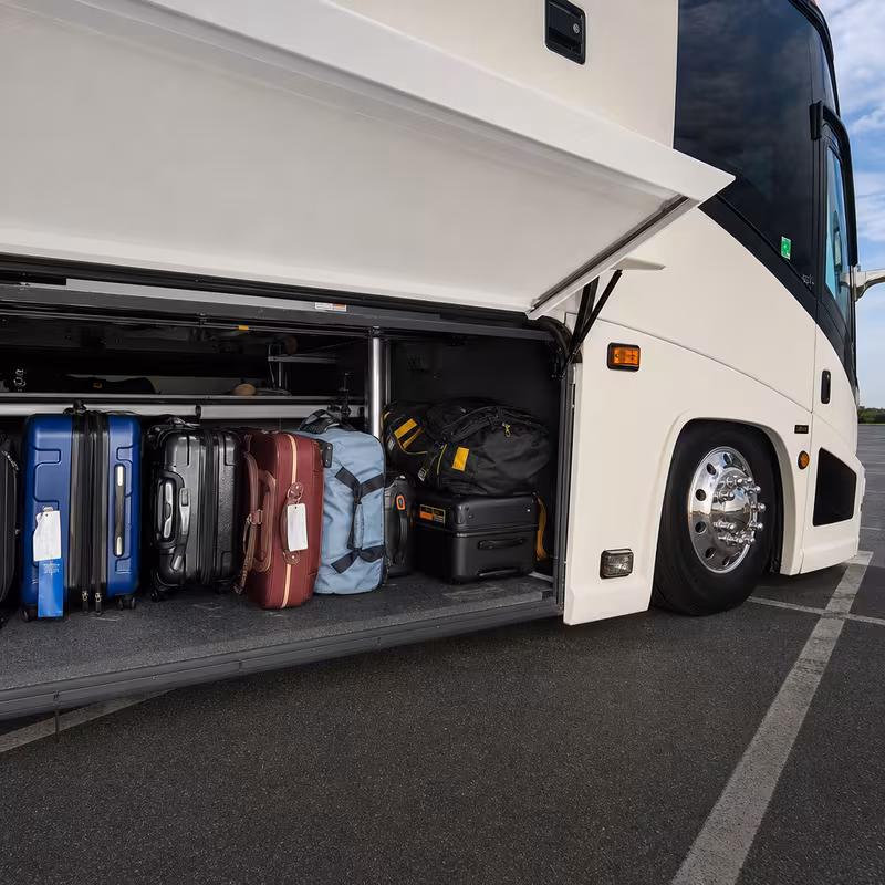 Party bus interior with wraparound leather seating and LED lighting in Dallas