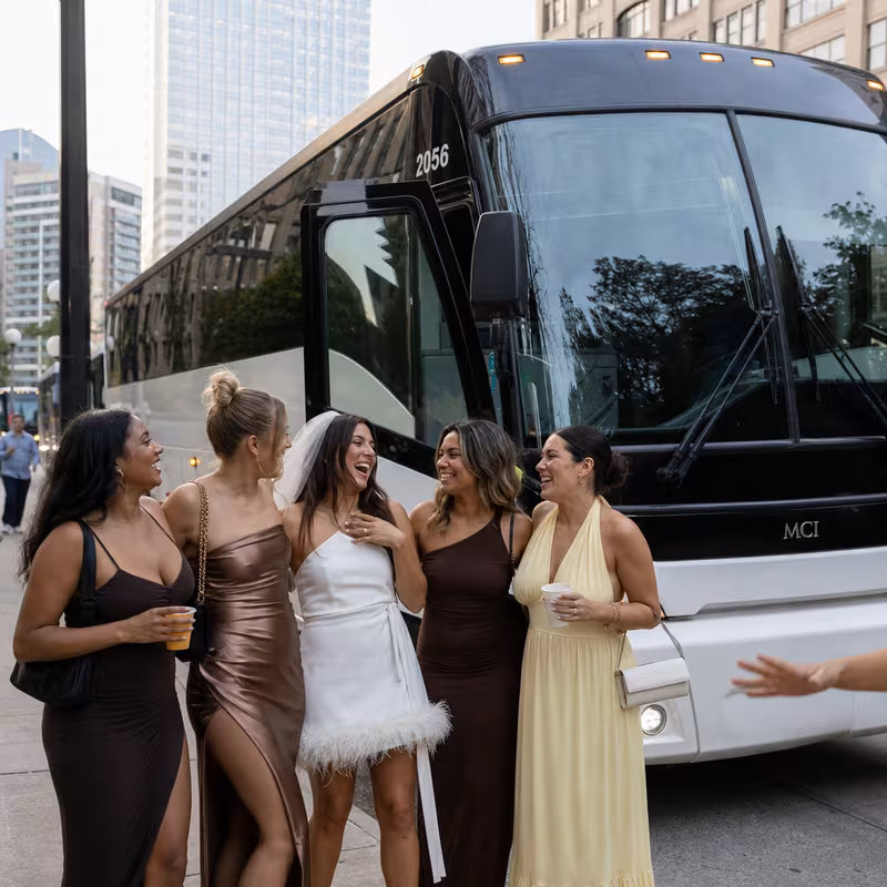 Passengers loading luggage while boarding an Dallas group shuttle
