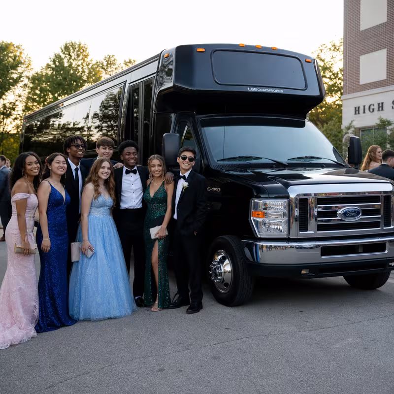 Group boarding a white charter bus for Prom & Homecoming Transportation transportation in Dallas