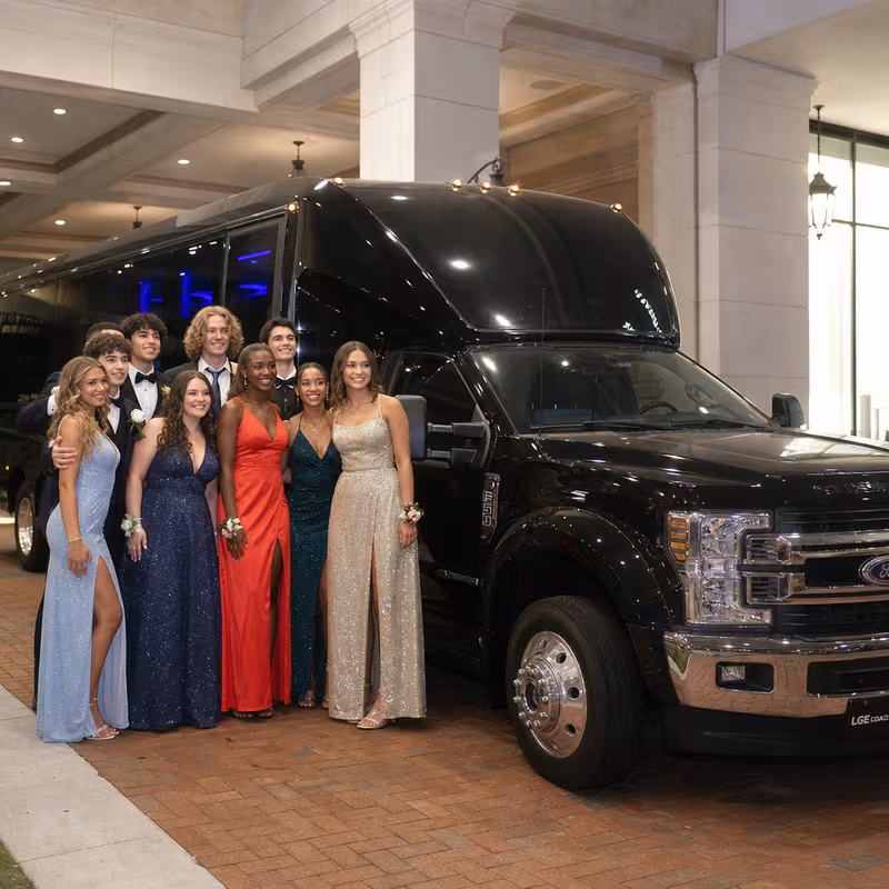 Party bus interior with wraparound leather seating and LED lighting in Dallas