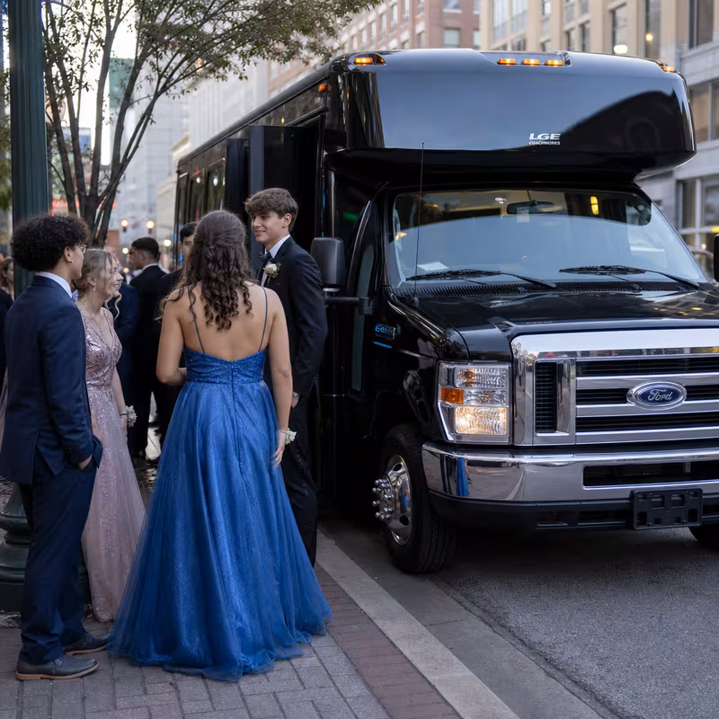 Passengers loading luggage while boarding an Dallas group shuttle