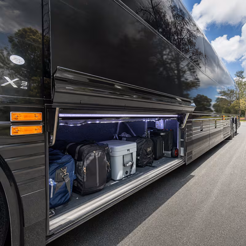 Party bus interior with wraparound leather seating and LED lighting in Dallas