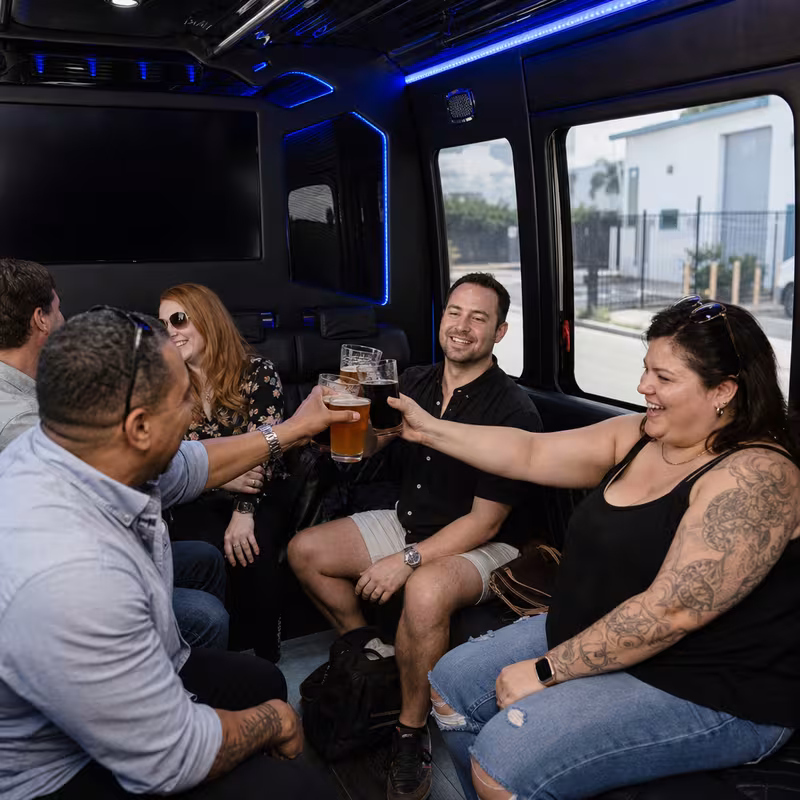 Group boarding a white charter bus for Winery & Brewery Tour Transportation transportation in Dallas